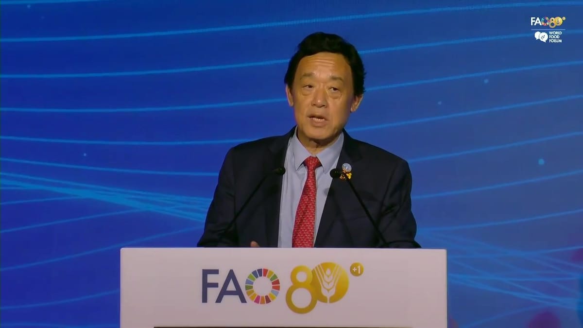 FAO Director-General QU Dongyu speaking at the lectern in FAO's Plenary Hall